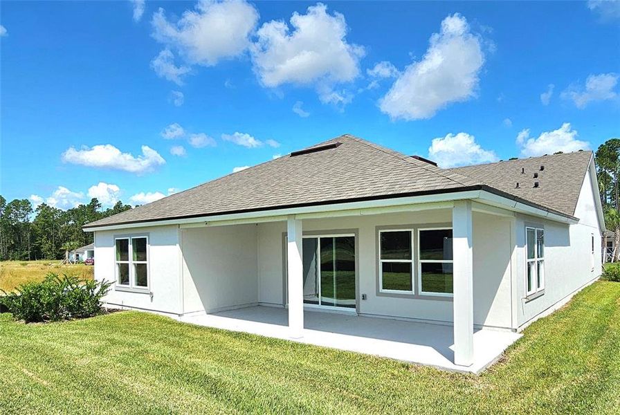 Exterior details and patio area of a home in Sawmill Branch Express, Palm Coast (Image 3).