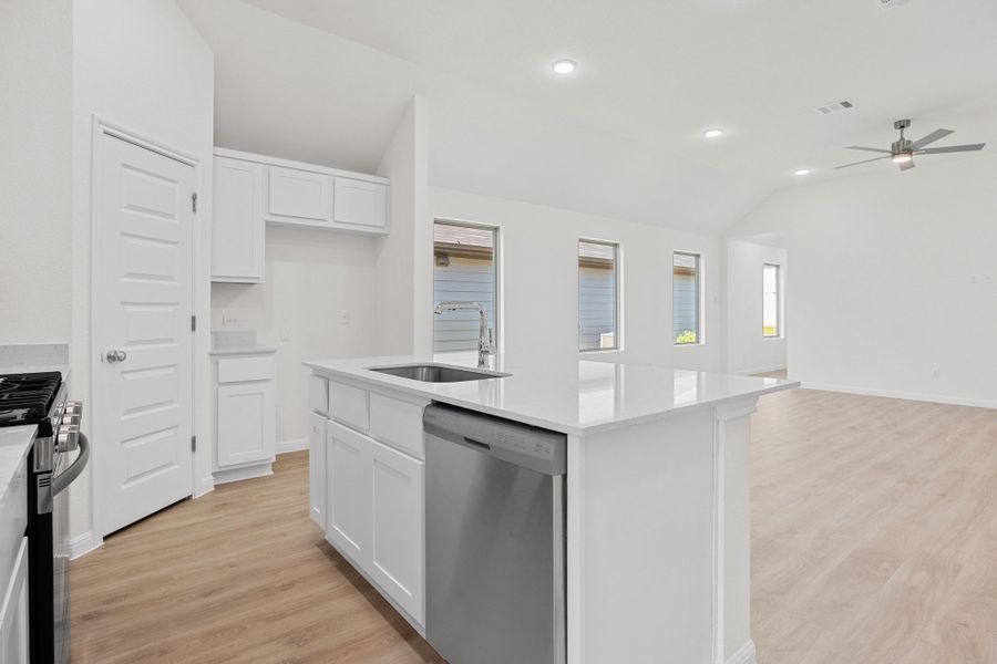 Kitchen in the Cypress home plan by Trophy Signature Homes - REPRESENTATIVE PHOTO