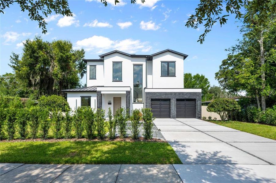 Front exterior of a new home in , Winter Park, FL, highlighting curb appeal (Image 1). Front exterior of a new home in , Winter Park, FL, highlighting curb appeal (Image 1).