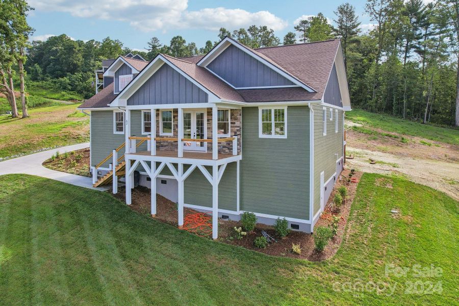 Front exterior of a new home in , Hendersonville, NC, highlighting curb appeal (Image 24). Front exterior of a new home in , Hendersonville, NC, highlighting curb appeal (Image 24).