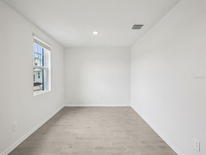 Spacious, unfurnished interior of a new home in Magnolia Bay - Classic Series, Nokomis (Image 11).