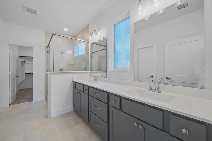 Representative furnished interior of a home built from the Sage by Chesmar Homes in Sunterra, Katy (Image 3).