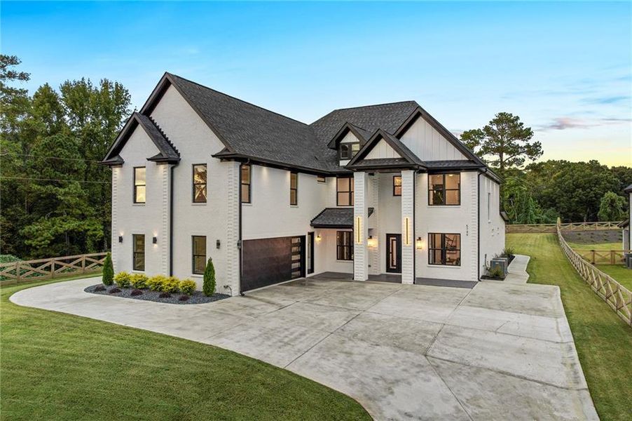 Front exterior of a new home in , Braselton, GA, highlighting curb appeal (Image 28). Front exterior of a new home in , Braselton, GA, highlighting curb appeal (Image 28).
