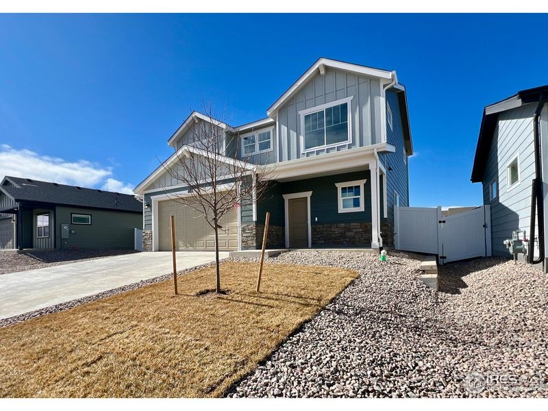 Front exterior of a new home in Union Colony West, Greeley, CO, highlighting curb appeal (Image 14).