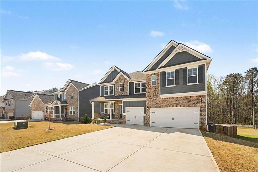 Front exterior of a new home in , Stockbridge, GA, highlighting curb appeal (Image 2). Front exterior of a new home in , Stockbridge, GA, highlighting curb appeal (Image 2).