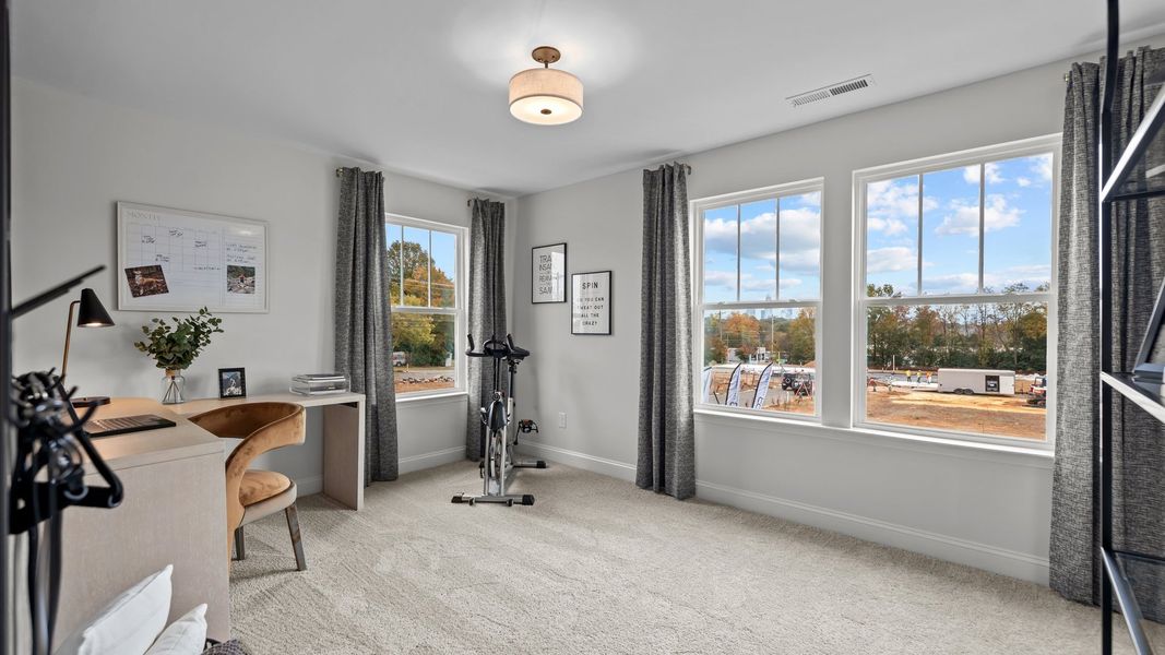 Flexible multi-purpose bedroom room with large windows, in the new Adaline Design by DRB Homes Charlotte, NC