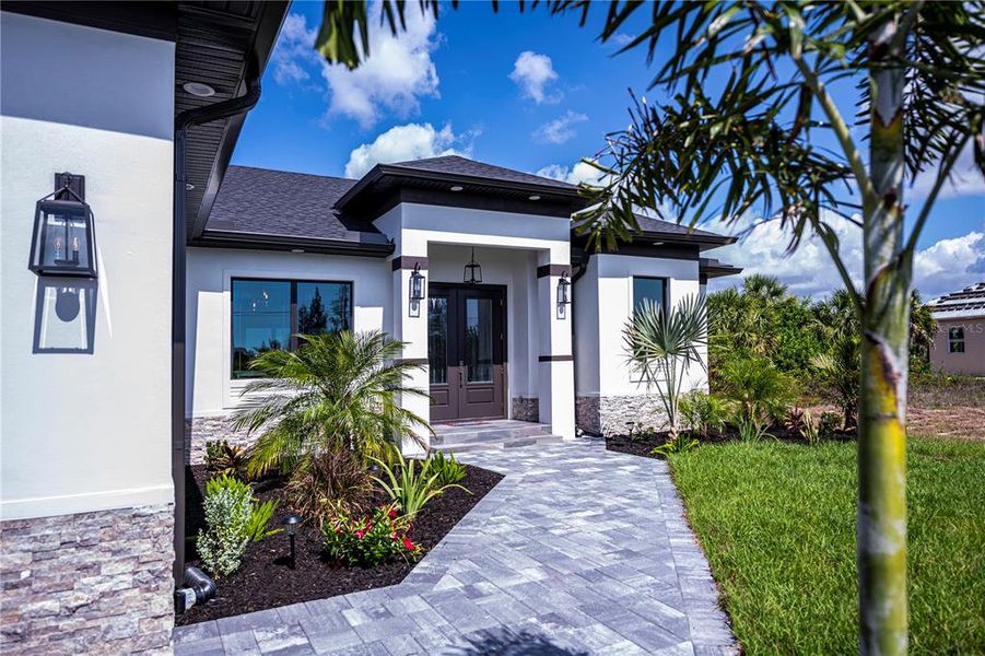 Front exterior of a new home in , Port Charlotte, FL, highlighting curb appeal (Image 24).