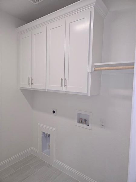 Laundry area with washer hookup, cabinet space, and electric dryer hookup Laundry area with washer hookup, cabinet space, and electric dryer hookup
