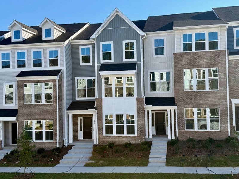 Front exterior of a new home in Renaissance at White Oak, Garner, NC, highlighting curb appeal (Image 1).