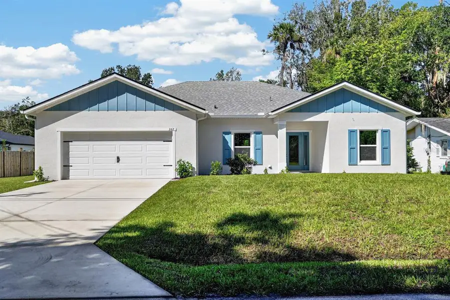Front exterior of a new home in , New Smyrna Beach, FL, highlighting curb appeal (Image 18).