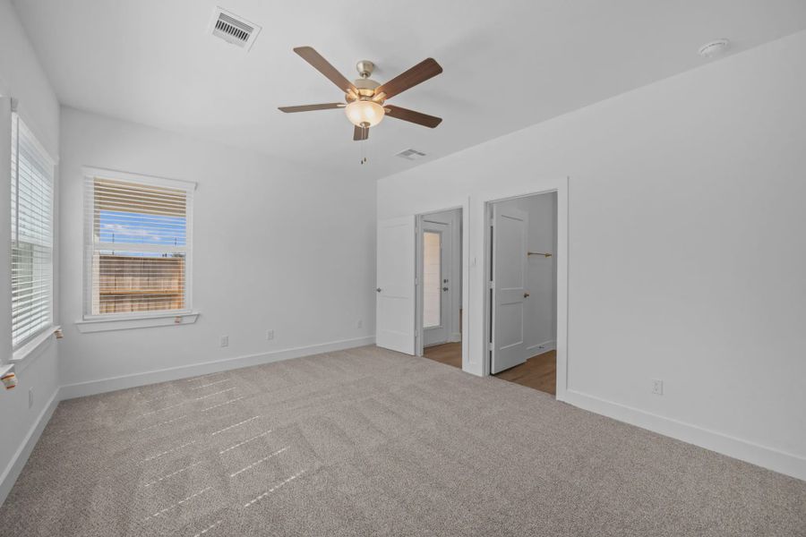 Representative unfurnished interior of a home built from the Carriagehouse by Chesmar Homes in Meridiana Townhomes, Iowa Colony (Image 87).