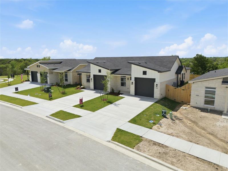 Front exterior of a new home in , Killeen, TX, highlighting curb appeal (Image 24).