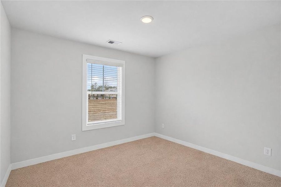 Spacious, unfurnished interior of a new home in The Fairways at Mirror Lake, Villa Rica (Image 28).