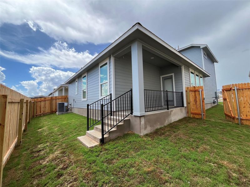 Exterior details and patio area of a home in Wellspring, Hutto (Image 1). Exterior details and patio area of a home in Wellspring, Hutto (Image 1).