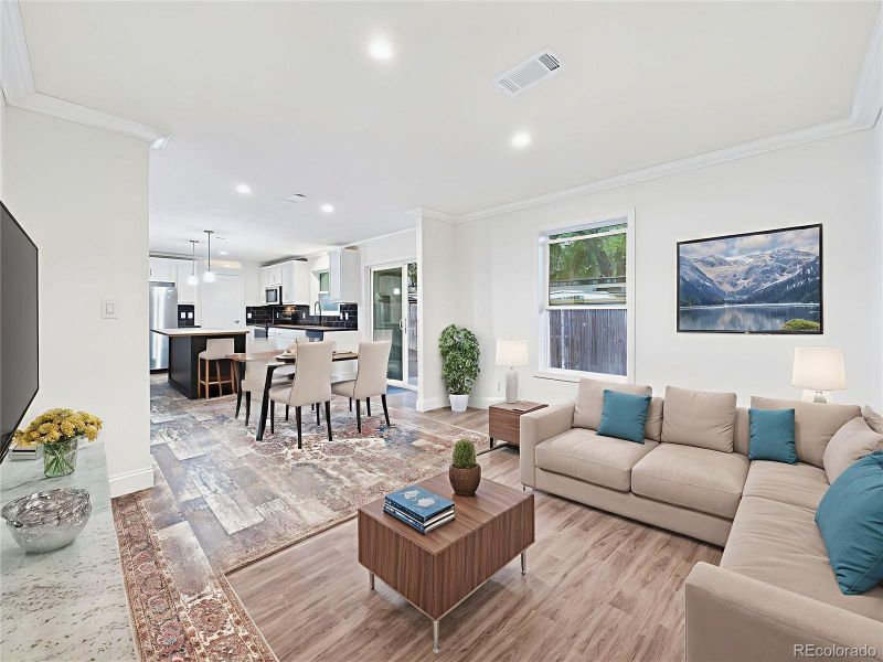 Virtually Staged to demonstrate multiple layout options—cozy family TV space or formal sitting area.