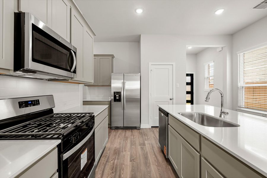 Furnished interior in a model home at Creekland Village at Bridgeland in Cypress (Image 1).