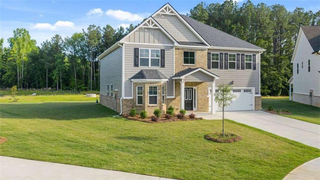 Front exterior of a new home in Wildwood, Covington, GA, highlighting curb appeal (Image 16).