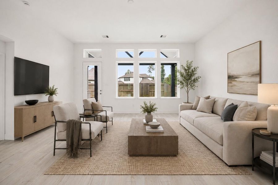 Experience modern elegance in this virtually staged, light-filled living room featuring sleek furnishings, stylish decor, and a serene ambiance perfect for relaxation and entertaining.