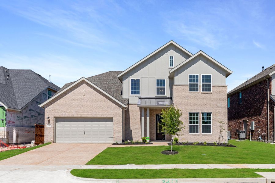 Representative exterior photo of a completed home built from the Kirby by UnionMain Homes in Edgewater, Fate, TX (Image 4). Representative exterior photo of a completed home built from the Kirby by UnionMain Homes in Edgewater, Fate, TX (Image 4).