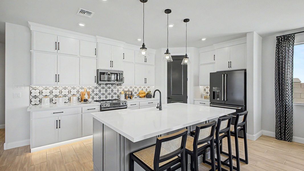 Modern kitchen island in this quick move-in new home by DRB Homes at Saguaro Hills at Vistancia, 32407 N 123rd Dr. Modern kitchen island in this quick move-in new home by DRB Homes at Saguaro Hills at Vistancia, 32407 N 123rd Dr.