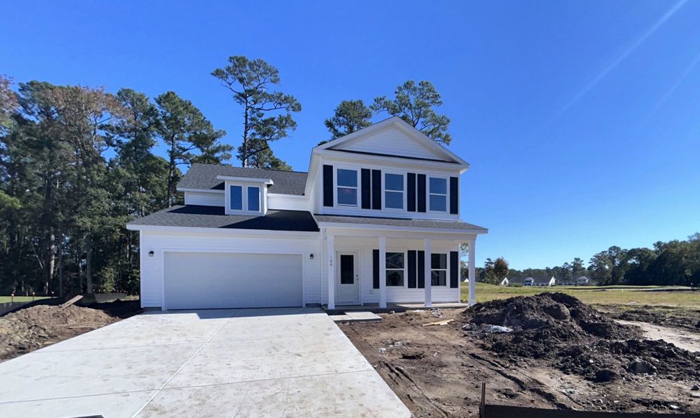 Front exterior of a new home in Trieste at Bella Vita, Myrtle Beach, SC, highlighting curb appeal (Image 2). Front exterior of a new home in Trieste at Bella Vita, Myrtle Beach, SC, highlighting curb appeal (Image 2).