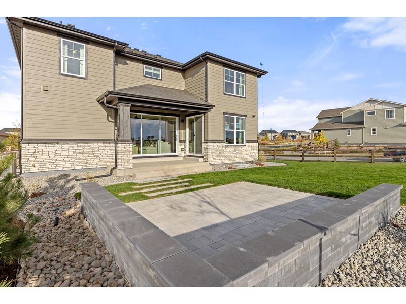 Exterior details and patio area of a home in Barefoot Lakes, Firestone (Image 2).