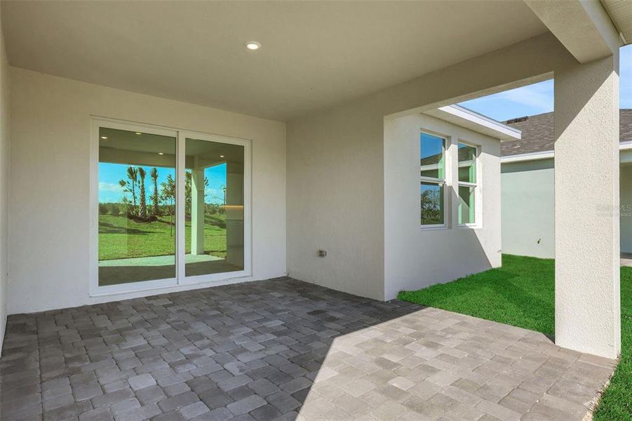 Exterior details and patio area of a home in Brystol North at Wylder, Port St. Lucie (Image 3).
