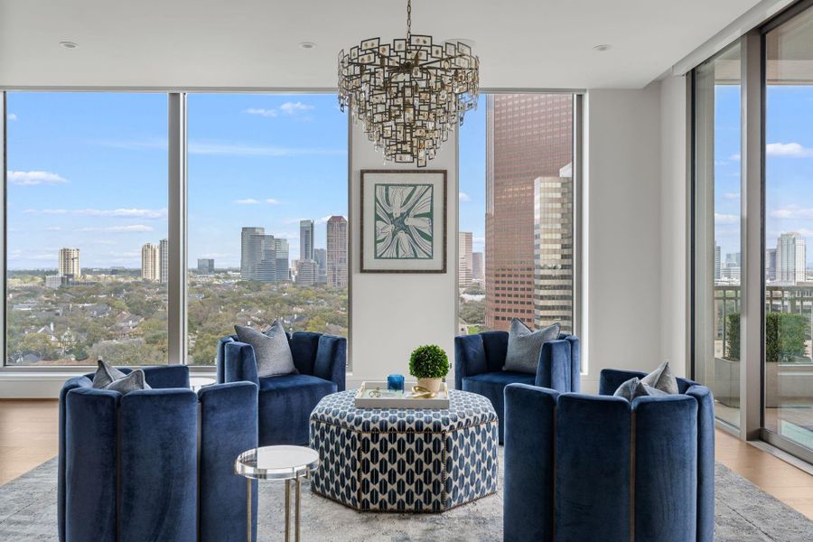 This elegant living area features floor-to-ceiling corner view windows offering stunning city views. This elegant living area features floor-to-ceiling corner view windows offering stunning city views.
