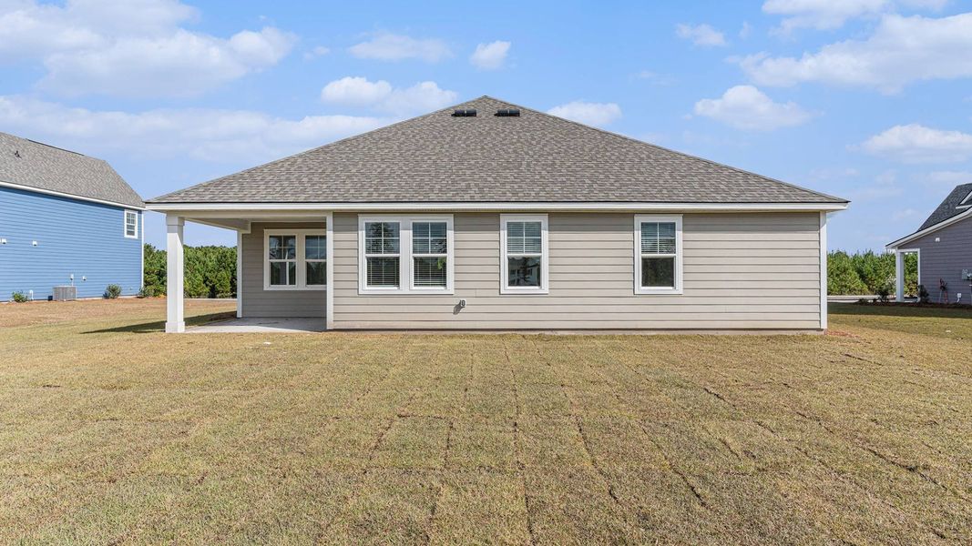 Exterior details and patio area of a home in Cedar Hill Landing, Navassa (Image 19).