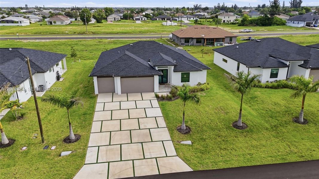 Front exterior of a new home in , Cape Coral, FL, highlighting curb appeal (Image 27).