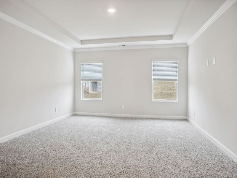 The primary bedroom is the best place to relax and unwind after a long day.