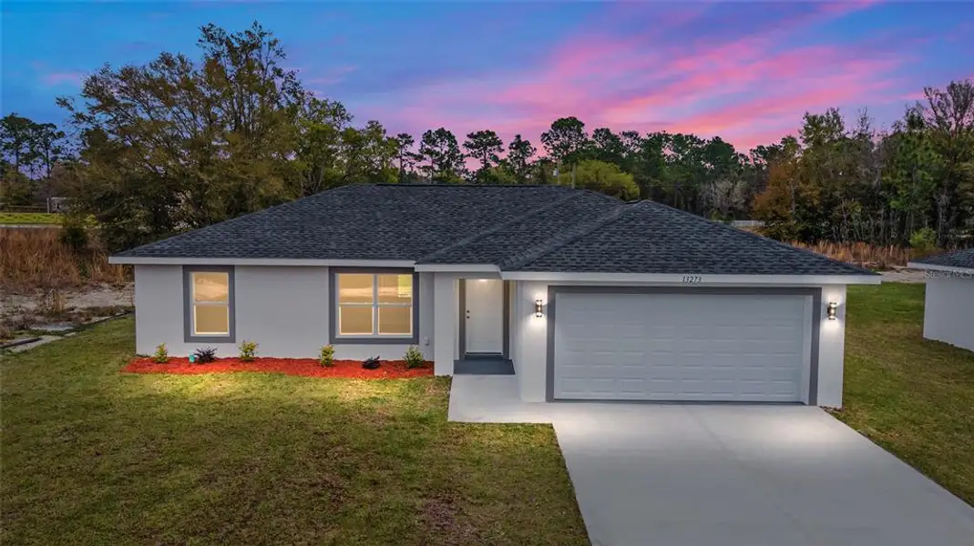 Front exterior of a new home in , Dunnellon, FL, highlighting curb appeal (Image 1). Front exterior of a new home in , Dunnellon, FL, highlighting curb appeal (Image 1).