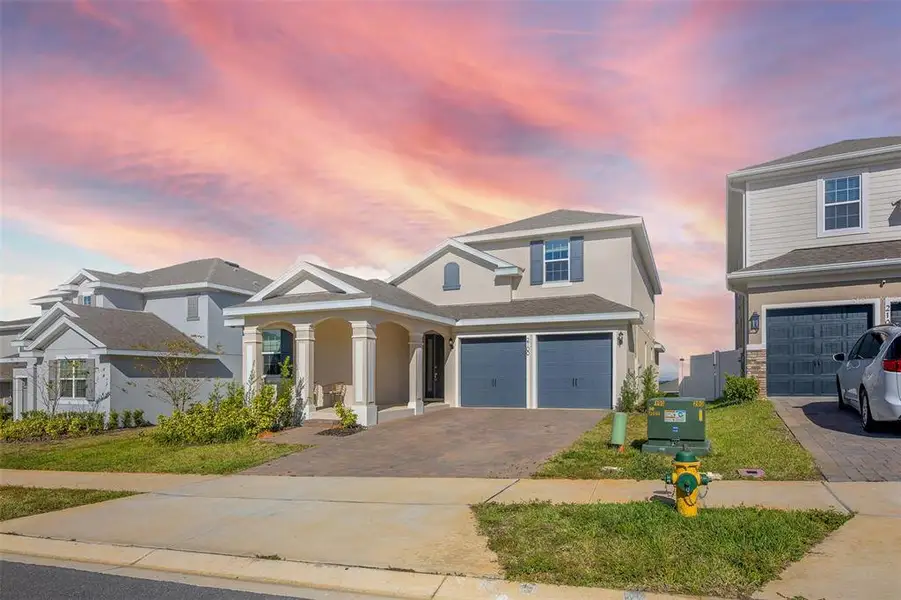Front exterior of a new home in , Minneola, FL, highlighting curb appeal (Image 1). Front exterior of a new home in , Minneola, FL, highlighting curb appeal (Image 1).