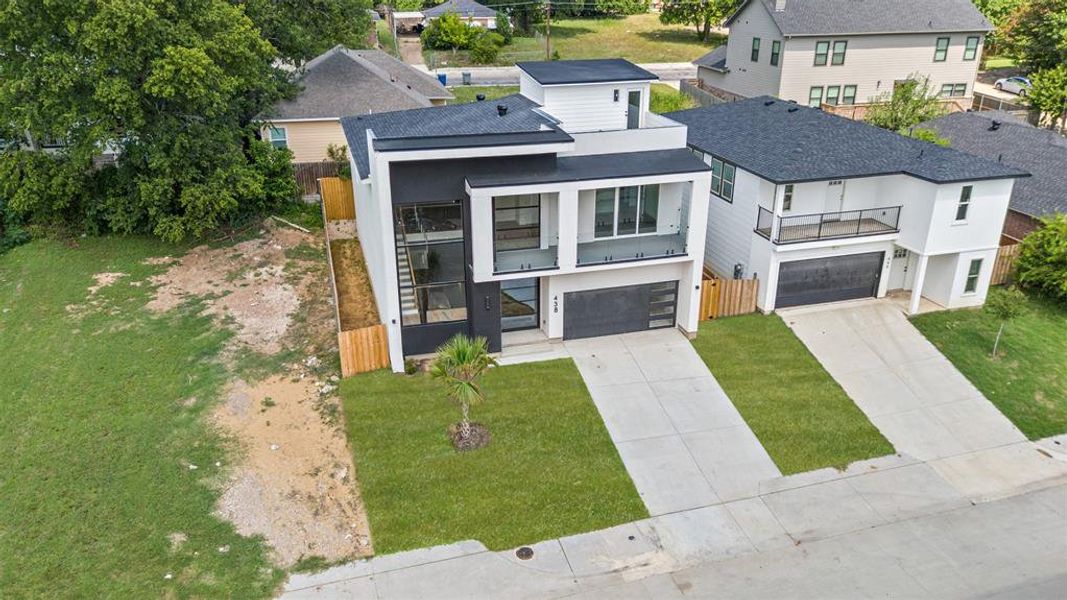 Front exterior of a new home in , Dallas, TX, highlighting curb appeal (Image 20).