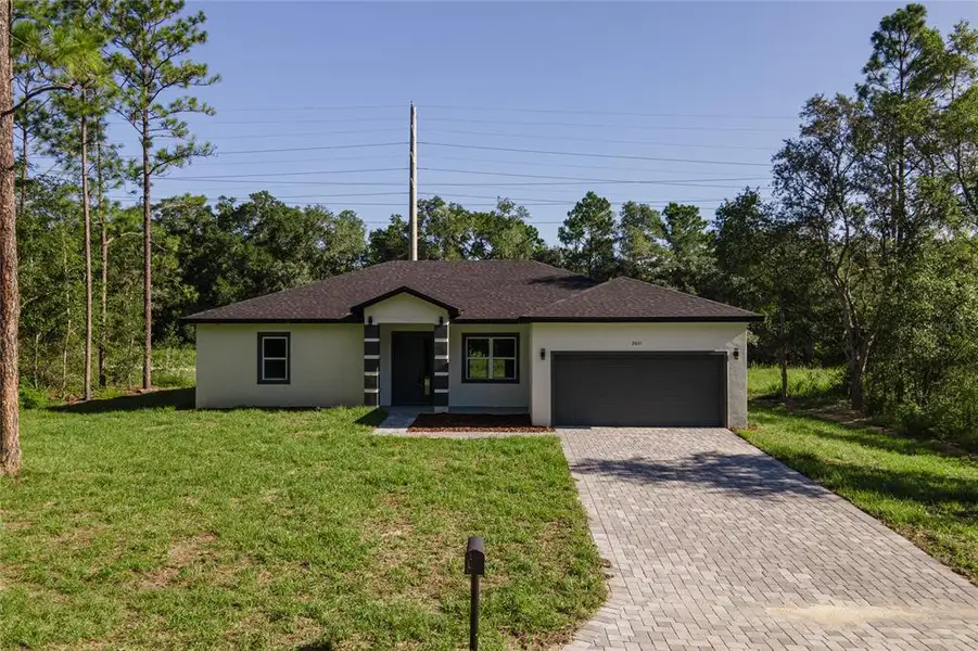 Front exterior of a new home in , Citrus Springs, FL, highlighting curb appeal (Image 2).
