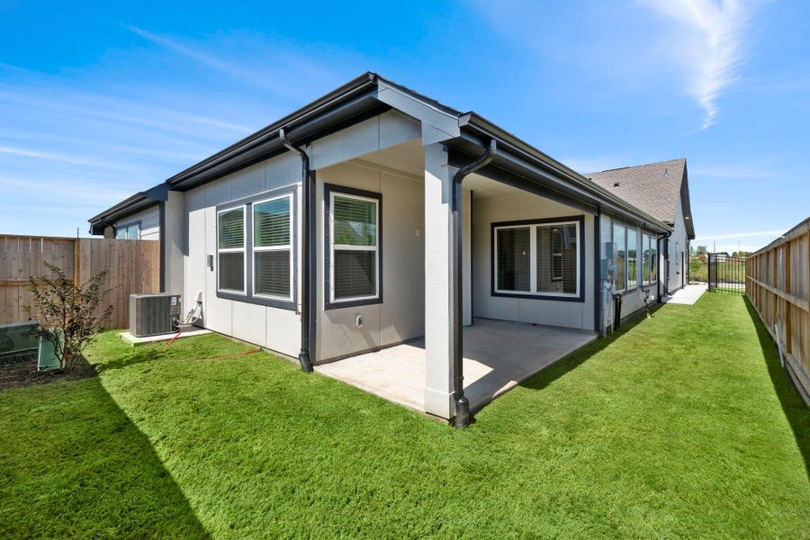 Exterior details and patio area of a home in Meridiana, Iowa Colony (Image 3).