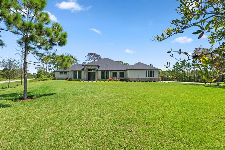 Front exterior of a new home in , Malabar, FL, highlighting curb appeal (Image 27).