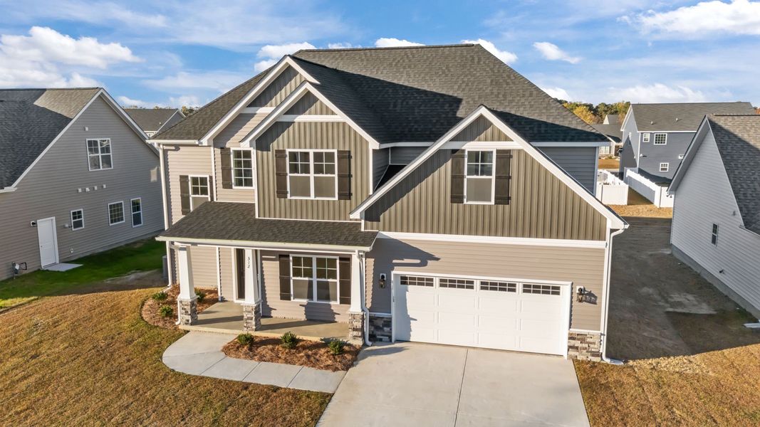Front exterior of a new home in Arbor Hills South II, Greenville, NC, highlighting curb appeal (Image 21). Front exterior of a new home in Arbor Hills South II, Greenville, NC, highlighting curb appeal (Image 21).