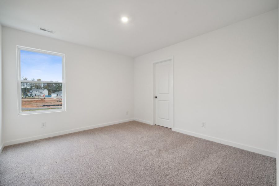 A room with a window and a door. A room with a window and a door.