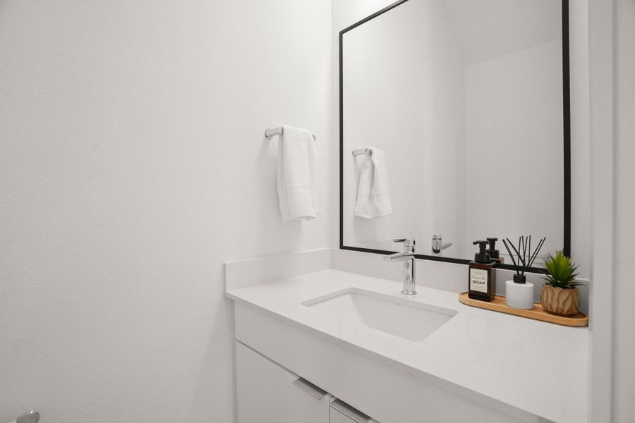 The main floor also offers a well appointed guest powder room. The main floor also offers a well appointed guest powder room.
