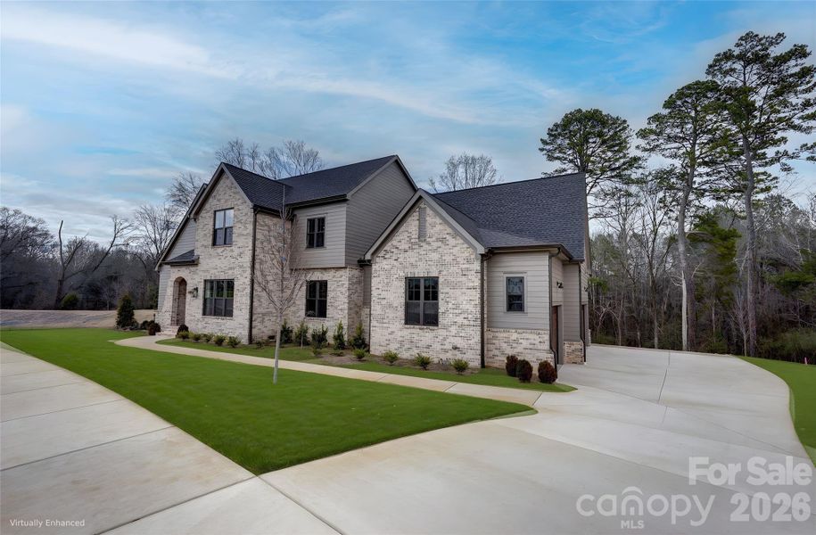 Front exterior of a new home in , Huntersville, NC, highlighting curb appeal (Image 25).