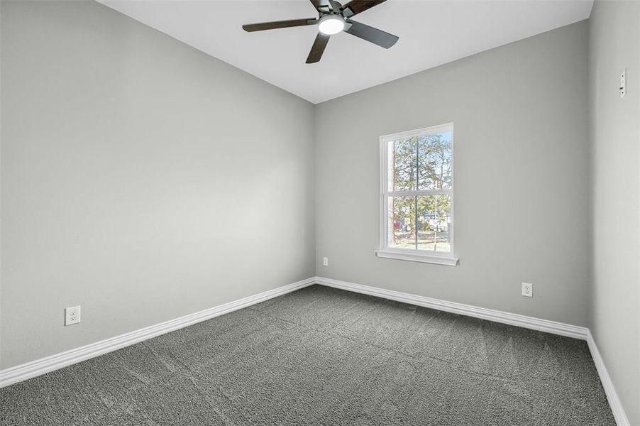 Unfurnished room with carpet flooring and ceiling fan