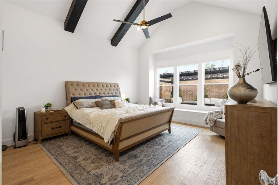 Primary suite with high ceilings and beams