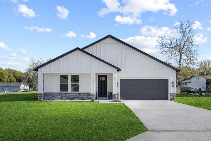 Front exterior of a new home in , Spring Hill, FL, highlighting curb appeal (Image 23).