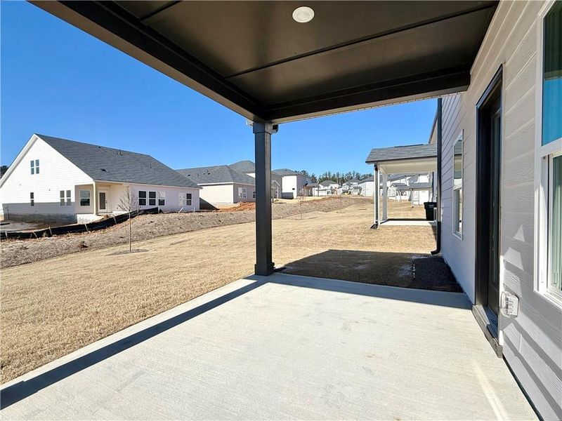 Exterior details and patio area of a home in Vines at Mill Creek - Estate Series, Braselton (Image 4).