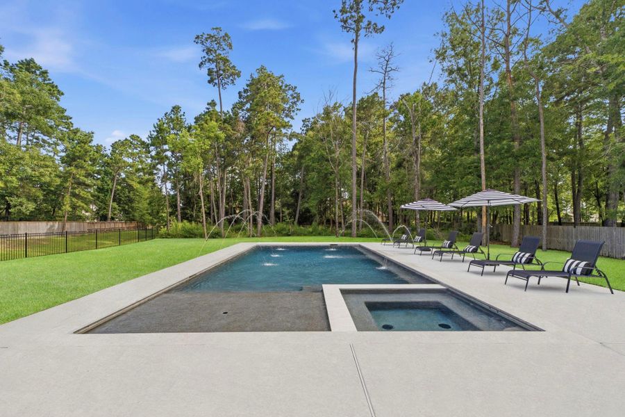 Resort level pool and spa with deck jets, sun shelf, lounging deck. Resort level pool and spa with deck jets, sun shelf, lounging deck.