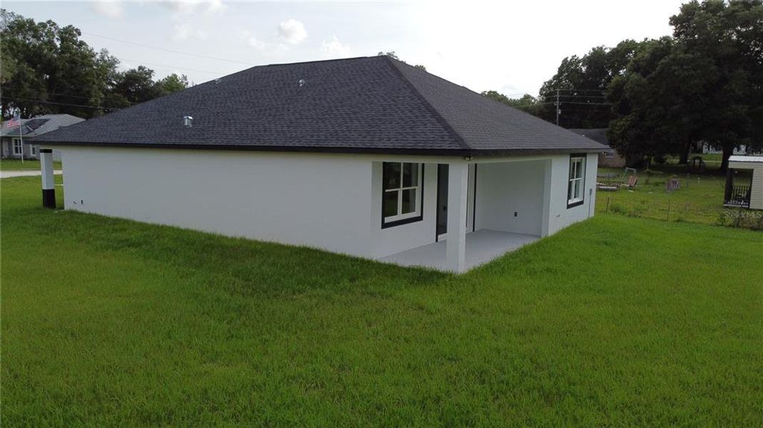 Exterior details and patio area of a home in , Summerfield (Image 32).