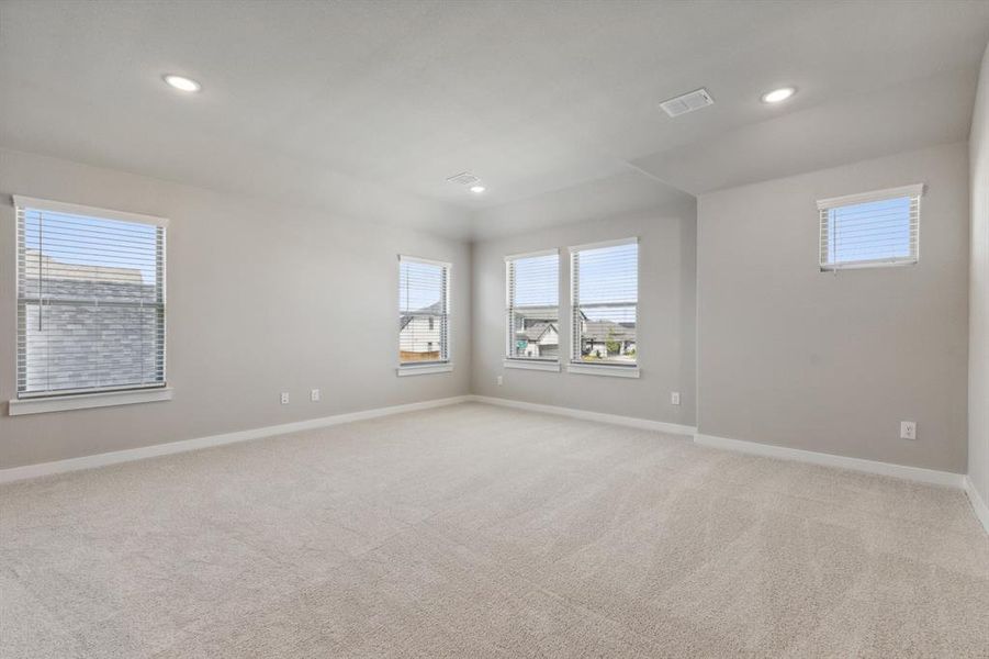 Game room in the Masters home plan by Trophy Signature Homes – REPRESENTATIVE PHOTO