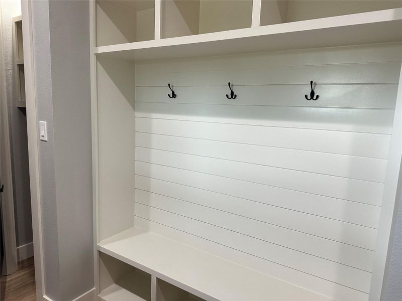 Built in cubbies for backpacks, sports gear, purses.