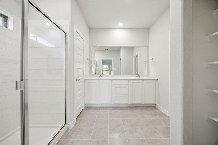 Primary Bathroom in the Emmy II home plan by Trophy Signature Homes - REPRESENTATIVE PHOTO